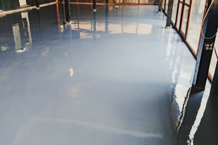 Newly laid basement floor with waterproof epoxy coating in Philadelphia, PA.