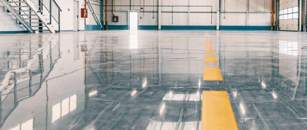 Shiny epoxy floor in aviation hangar in Philadelphia, PA.